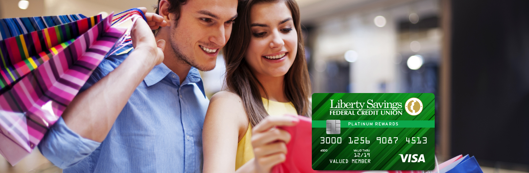 Photo of couple shopping for clothes with Visa card image